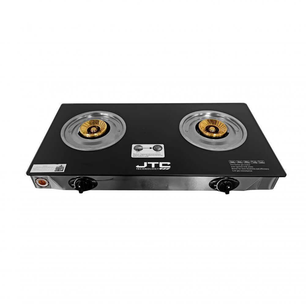 JTC GSSP-2GB072 double burner gas cooker with black tempered glass top, two brass burners with golden flame spreaders, stainless steel body, and individual control knobs